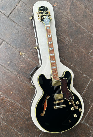 Top view Epiphone Sheraton black finish, gold hardware, rosewood fretboard with pearl block inlays, back headstock with leaf inlay