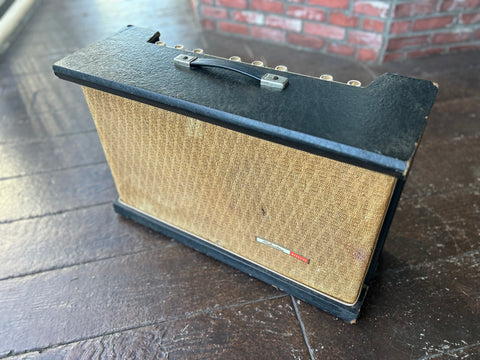 Front view, Silvertone amplifier, black top with tan fabric over