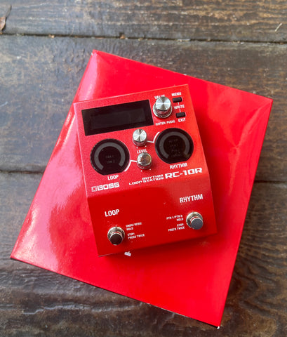 Top view, red Boss Looper Pedal with two button controls
