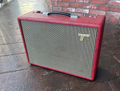 Red tolex Tiesco amplifier with black and grey weave cloth, black handle 