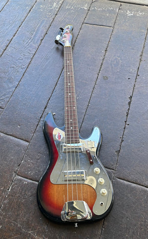 Teisco bass sunburst with metal pick guard and metal pick ups, rosewood fretboard with white dot inlay, brown headstock