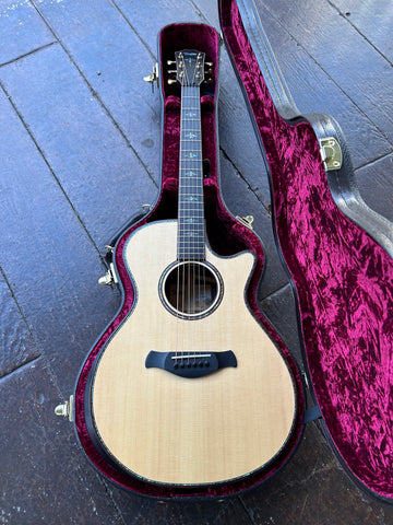Top view spruce top acoustic taylor guitar with ebony bridge, and ebony fingerboard, abalone design inlays, Taylor rosewood headstock