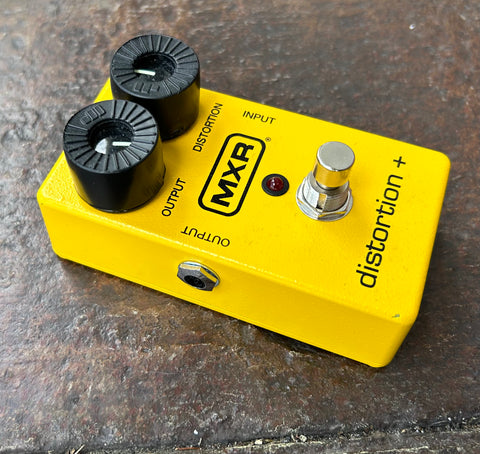 Yellow MXR distortion plus pedal, with two black control knobs