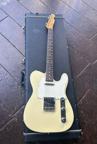 top view cream telecaster body with white pick guard, rosewood fretboard with white dot inlays, fender maple headstock
