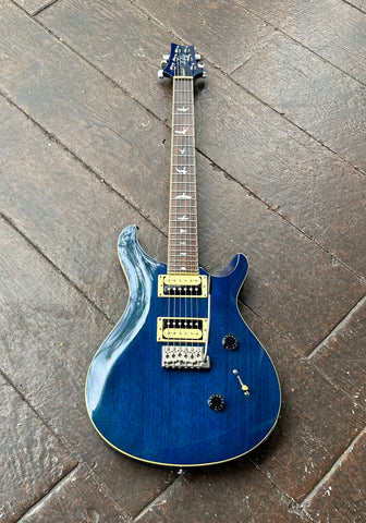 PRS Blue finish electric gutiar with black and tan pick ups, metal tremolom with rosewood neck, bird pearl design inlays, blue headstock