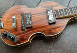 Top view Koa body with roswewood bridge, two metal pick ups. Wood control plate, dark wood knobsmetal tailpiece