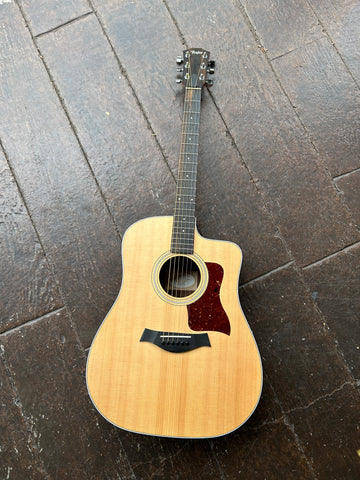 Spruce top Taylor with ebony fretboard and  wood headstock