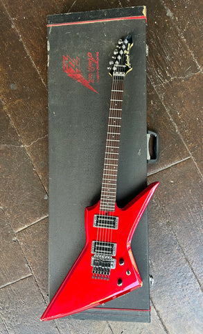 Top view Red Aria guitar, black pick ups, rosewood fretboard with white dot inlays, with black headstock