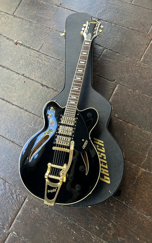 top view Black Gretsch, three pick ups in gold with gold Bigsby, rosewood fretboard with block pearl inlays, black headstock