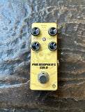 Philosopher's Gold yellow mini pedal, with four black knobs, single button footswitch