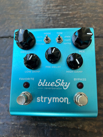 Blue metal Strymon Blue Sky pedal, five black control knobs, two metal button foot controls
