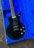 top view dean black electric guitar with humbucker pick ups, four knobs gold 