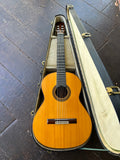 Contrearas classical guitar in a case on a wooden floor