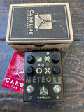 Caroline Guitar Company Metéore lo-fi reverser pedal with packaging on a wooden surface