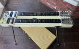 Fender double neck off white lapsteel guitar on a stand with a brick wall background