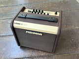 Fishman Loudbox Micro brown and tan amplifier on a wooden surface