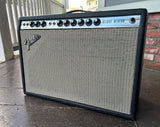 1975 Fender Deluxe Reverb Silverface amplifier with black tolex , grey grill cloth and silver control panel