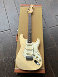 tan 1996 Fender Stratocaster with white pick guard and rosewood neck and maple headstock