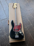 1999 Fender American Vintage 62 Jazz Bass black finish with red pick guard. rosewood pick-guard and maple headstock