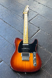2016 Fender Modern Player Telecaster Plus Honey Burst guitar with black pick guard and maple headstock on wooden surface