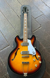 Sunburst brown Epiphine Csino arch top guitar on wooden surface