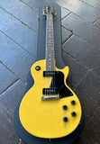 2021 Gibson Les Paul Special, TV Yellow finish with black pick ups, rosewood fretboard, black headstock. on case resting on wooden floor