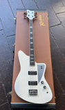 Rivolta White electric bass guitar on a brown case with a dark wooden floor background 