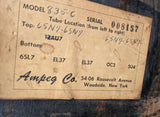Vintage label with technical specifications and branding on a wooden surface