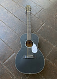 Aria Black acoustic guitar on a textured dark surface