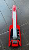Red electric lap steel guitar  ona dark concrete floor