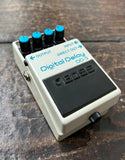 Digital Delay DD-3 guitar effects pedal on a wooden surface