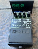 Boss RE-2 Space Echo Delay and Reverb Effects Pedal green and black guitar pedal with four knob controls