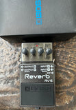 grey and metal Boss Reverb RV-6 guitar effects pedal with four knob controls on a textured surface