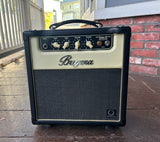 Bugera guitar amplifier on a wooden deck with a brick wall in the background