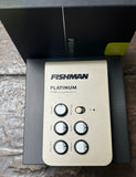Silver Fishman Platinum Stage audio processor on a textured surface
