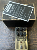 Friedman SmallBox Overdrive Pedal in gold and black with six control knobs, with packing