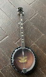 Harmony Banjo with eagle head logo, rosewood fretboard and black headstock