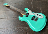 Surf green Aria Diamond DM-380 electric guitar with black pick-ups and rosewood fretboard and surf green headstock