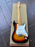 fender sunburst guitar on case