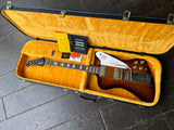 Top view sunburst Gibson firebird in yellow case, trapezoid inlays, black headstock