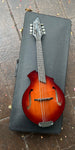 Breedlove Mandolin Sunburst resting on case 