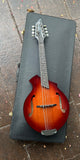 Breedlove Mandolin Sunburst resting on case 