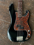 fender bass body black with brown pick guard with two pickups and mental knobs