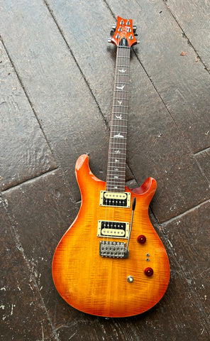 Top view PRS sunburst electric guitar, humbucker pick uops, rosewood fretboard with bird inlays and sunburst headstock