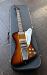 Top view sunburst Gibson firebird in yellow case, trapezoid inlays, black headstock
