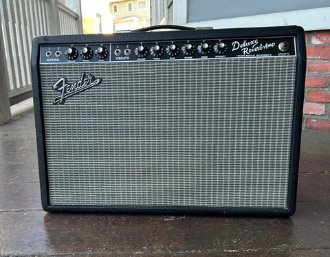 Fender 65 Reissue Deluxe Re3verb amplifier, black tolex, silver grill cloth, black control panel and nine control knobs