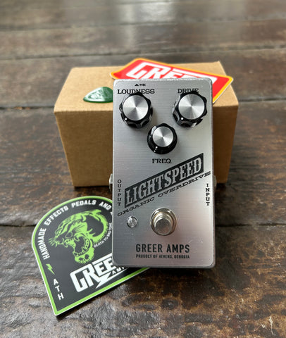 Greer Amps Oranic Overdrive Moonshot Silver pedal with three control knobs, single button footswitch