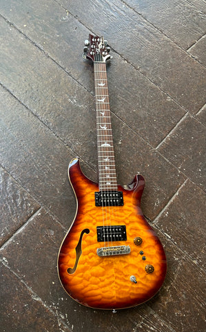 PRS SE Quilted maple, sunburst, with rosewood fretboard, bird perl inlay design, and brown headstock