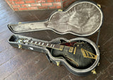 Top view Grey D'Angellco jazz guitar, gold hardware with roswood fretboard and pearl block inlays