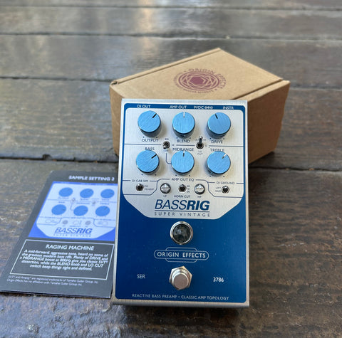 Origin Effects BASSRIG Super Vintage effects pedal, metal enclosure, blue an silver with six blue meal knobs and single button foot switch